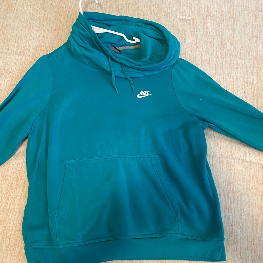 A blue Nike turtleneck sweatshirt